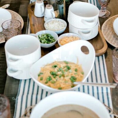 Dinner table with soup and bowls.