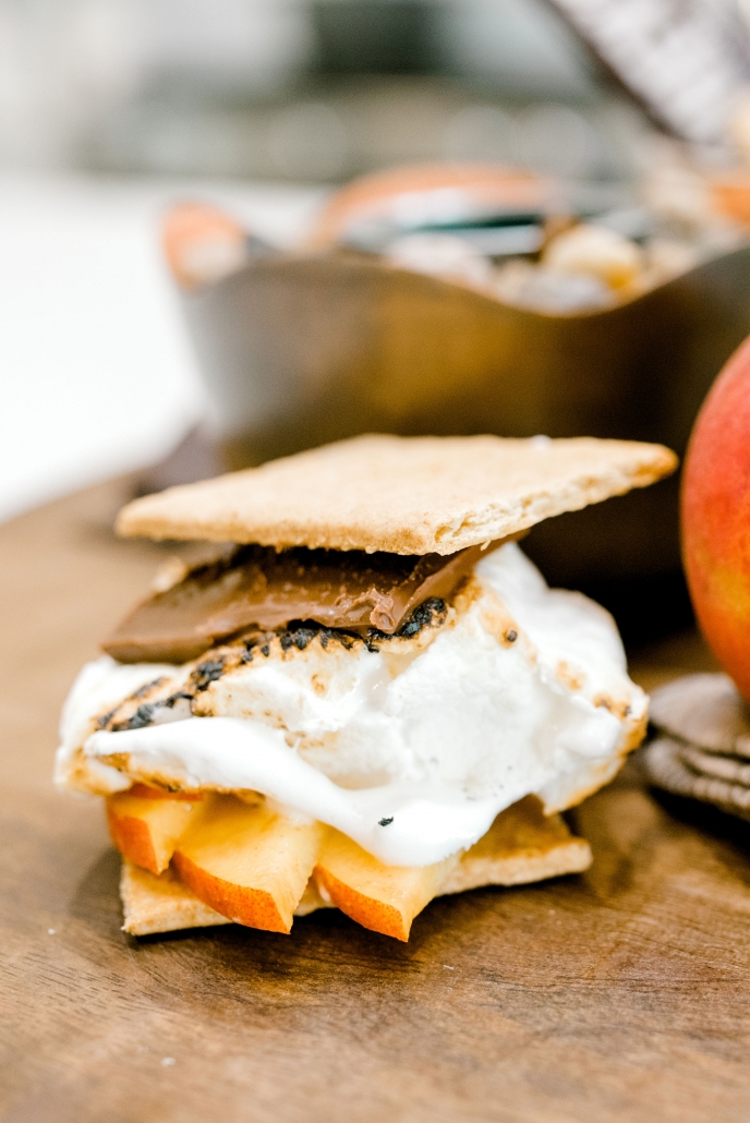 Graham cracker with peaches, marshmallow, and chocolate.