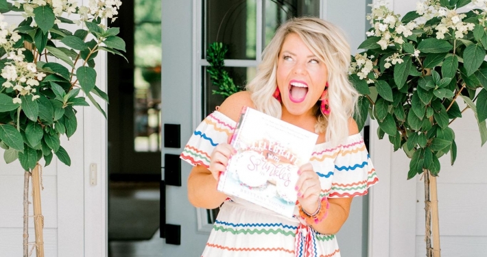 Brittany holding a copy of Celebrate with Sprinkles book