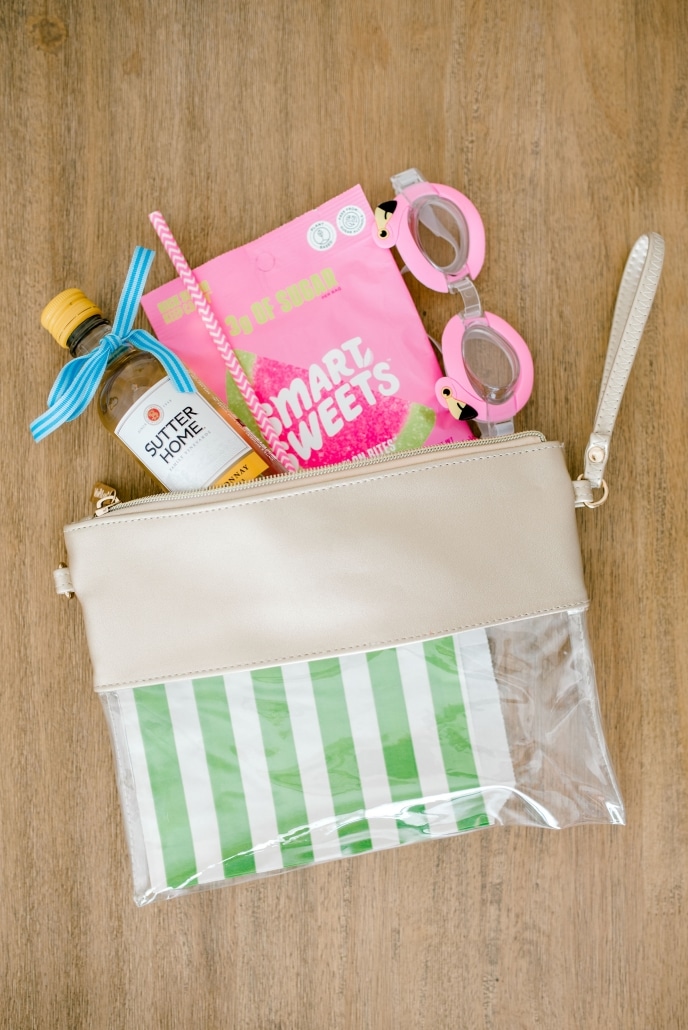 Clear clutch from Viv & Lou filled with travel goodies.