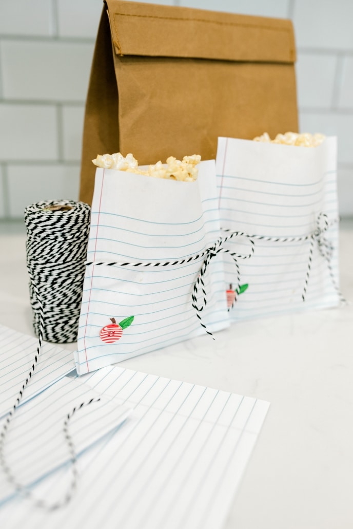 Popcorn pouches made from loose leaf paper.
